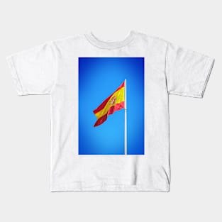 Spanish flag waving against clear blue sky Kids T-Shirt